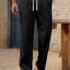 COMBRAIDED Loose Fit Men Black Trousers